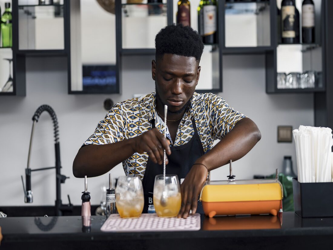 Bartender crafting a cocktail at Veronique Heights