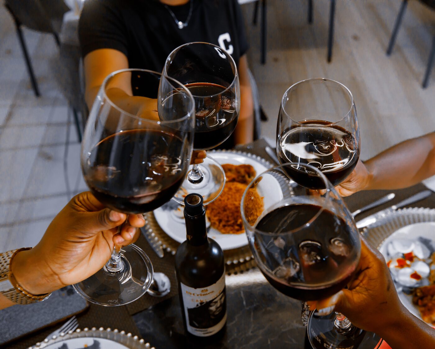 Guests toasting with wine at the Veronique Heights bar