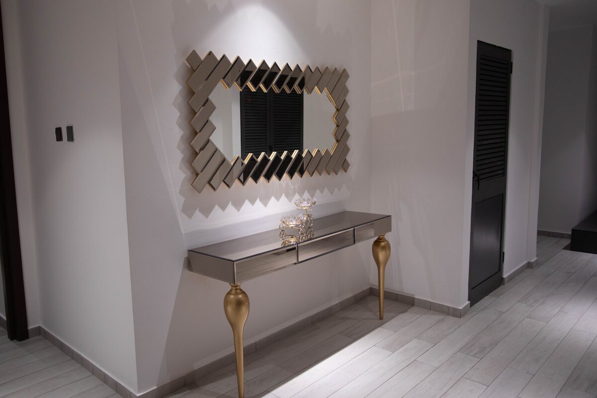 Champagne-gold console and mirror detail