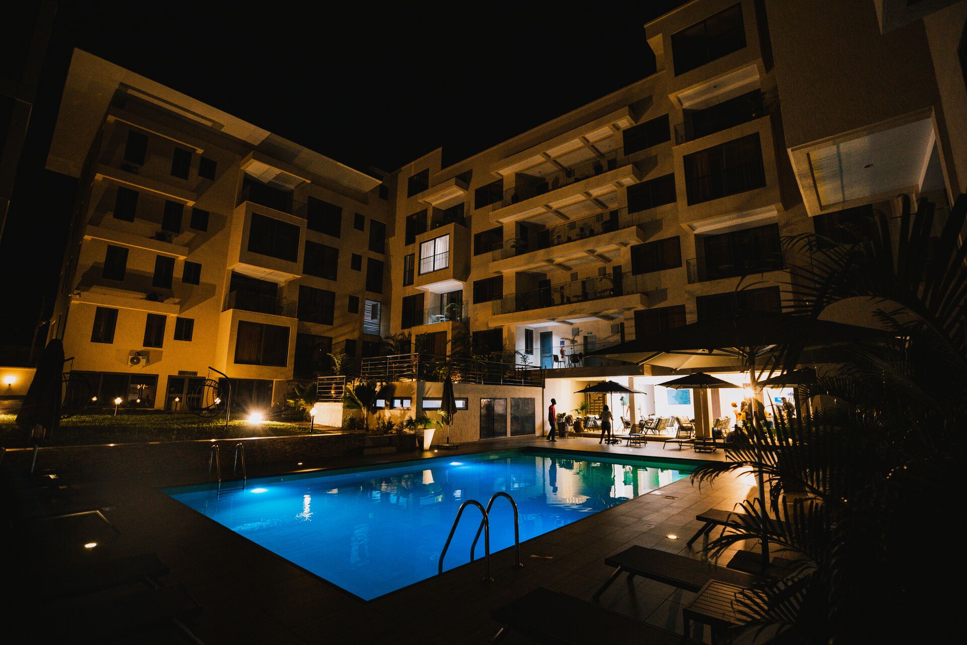 Veronique Heights luxury serviced apartments and pool at dusk, Danyame, Kumasi